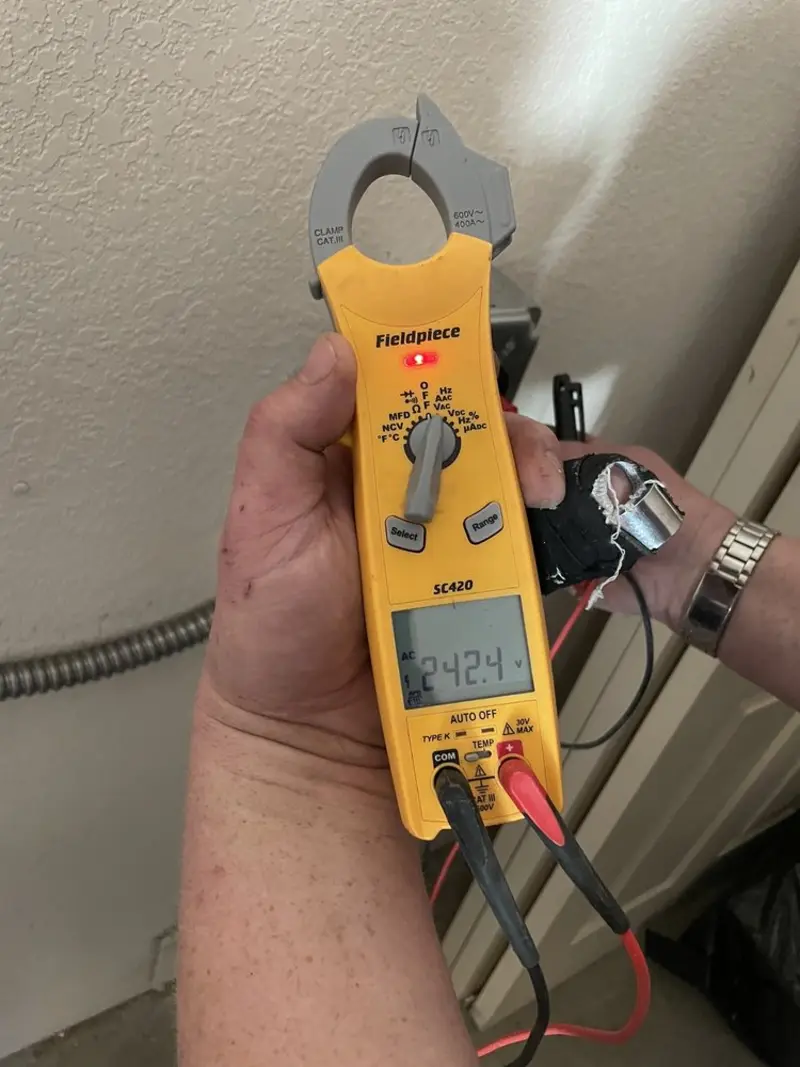 Voltage testing with clamp meter during Circuit Breaker Repair in Falcon Heights